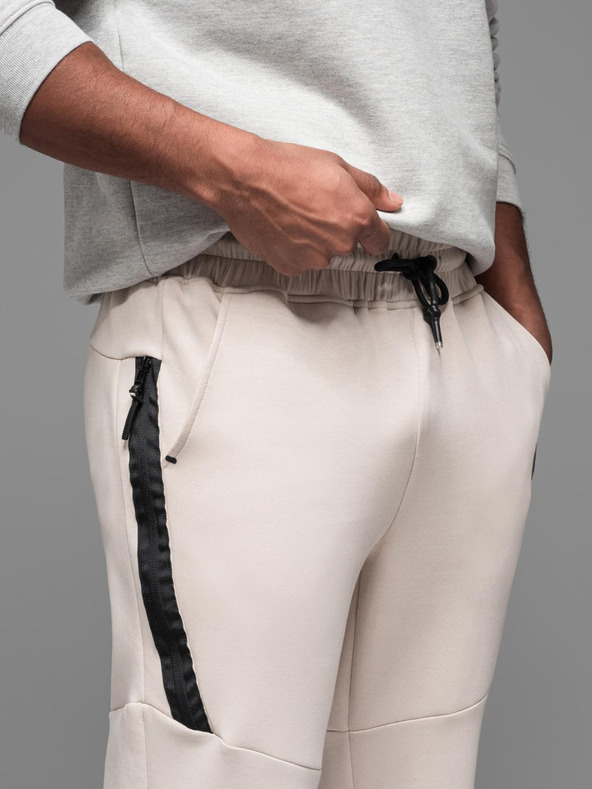 Ombre Clothing Pánske tepláky s rebrovanými manžetami a ozdobným zipsom - pieskové Oblečenie Ombre