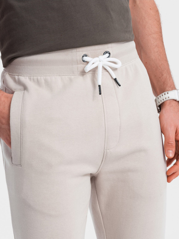 Ombre Clothing Béžové pánske tepláky Ombre Oblečenie