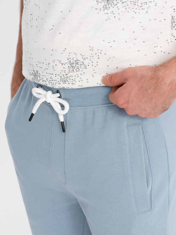 Ombre Clothing Svetlomodré pánske tepláky Ombre oblečenie