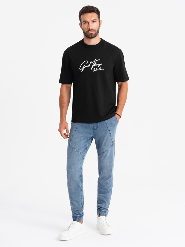 Ombre Clothing Pánske džínsové tepláky s asymetrickým prešívaním modré Ombre Oblečenie