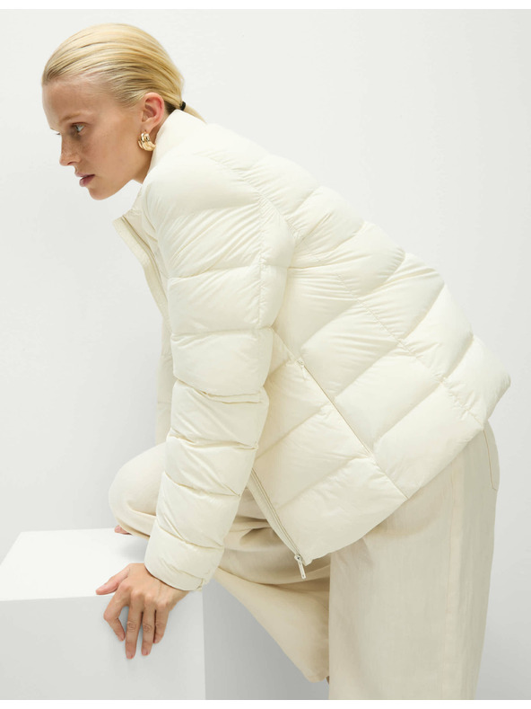 Marks & Spencer Prešívaná skladateľná bunda s perím a páperím Marks & Spencer smotanová