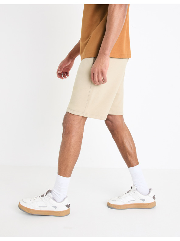 Celio Béžové pánske tepláky Celio Toshort