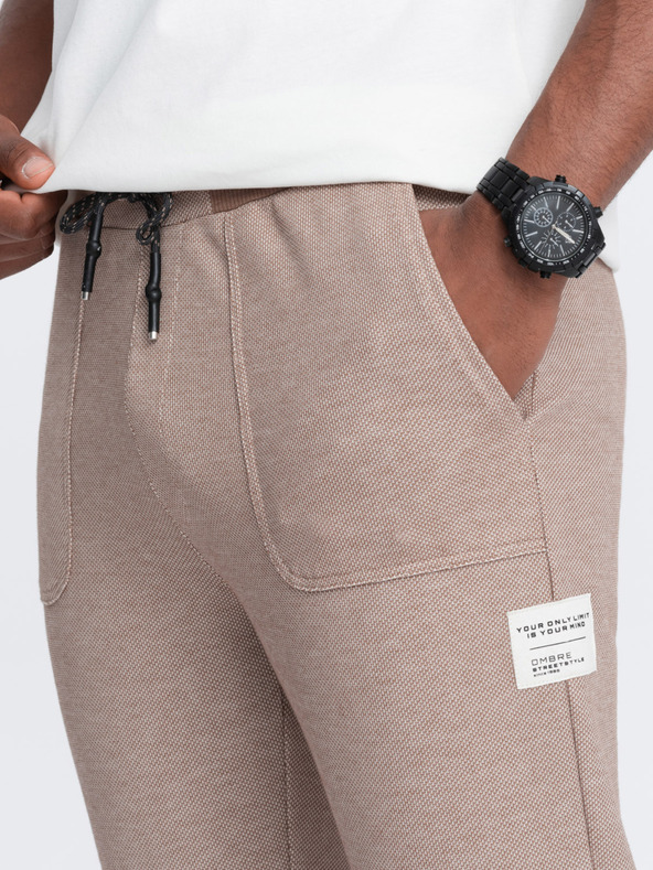 Ombre Clothing Svetlohnedé pánske tepláky Ombre Oblečenie