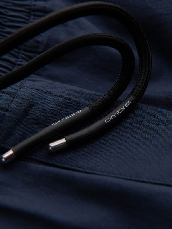 Ombre Clothing Tmavomodré pánske nohavice cargo jogger Ombre Clothing