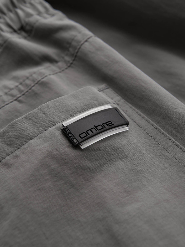 Ombre Clothing Pánske jogger nohavice s vreckami a potlačou sivá Ombre Oblečenie