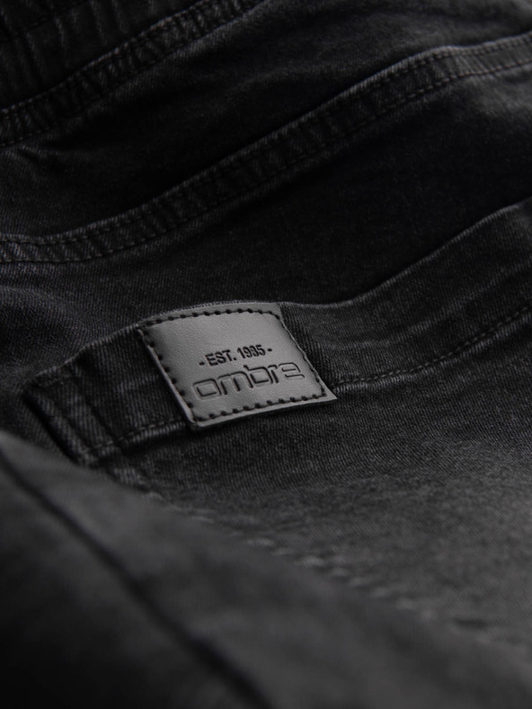 Ombre Clothing Pánske džínsové tepláky s asymetrickým prešívaním čierne Ombre Oblečenie