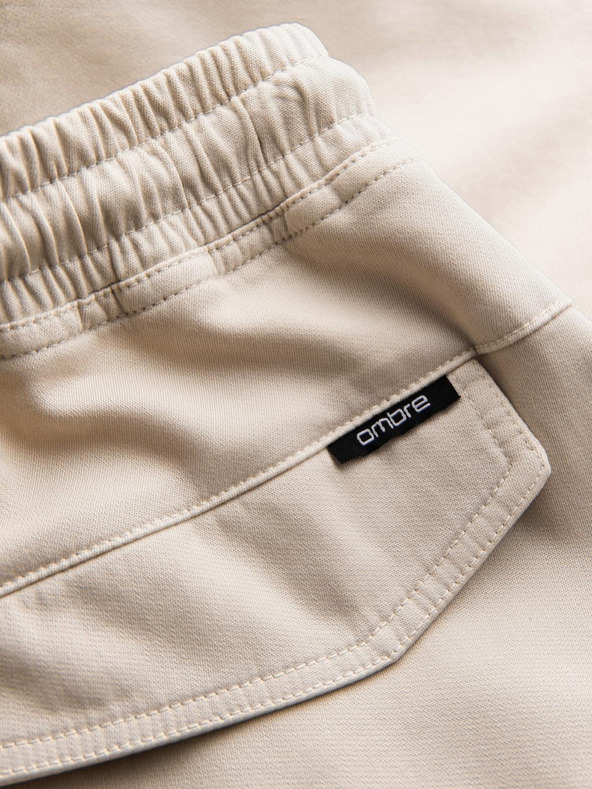 Ombre Clothing Pánske pletené tepláky s cargo vreckami krémové Ombre Clothing