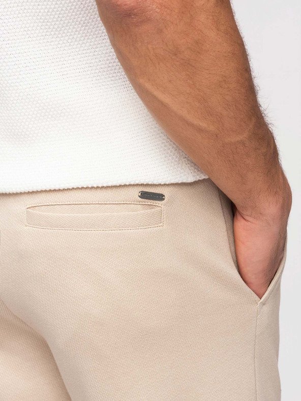 Ombre Clothing Pánske voľnočasové nohavice CARROT FIT zo žakárdového úpletu - béžové V2 OM-PACP-0292 Ombre Clothing